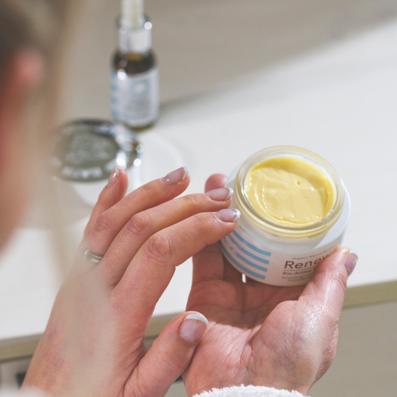 Renewal Bio-Active Moisturiser jar with fresh botanical ingredients for deep hydration and skin rejuvenation.